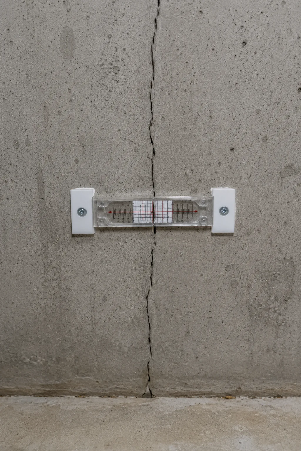 White crystalline efflorescence deposits on a concrete block basement wall